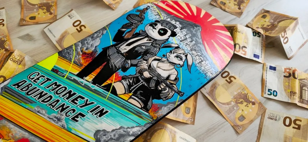 Painted skateboard depicting an armed panda and rabbit with text GET MONEY IN ABUNDANCE, surrounded by Euro notes