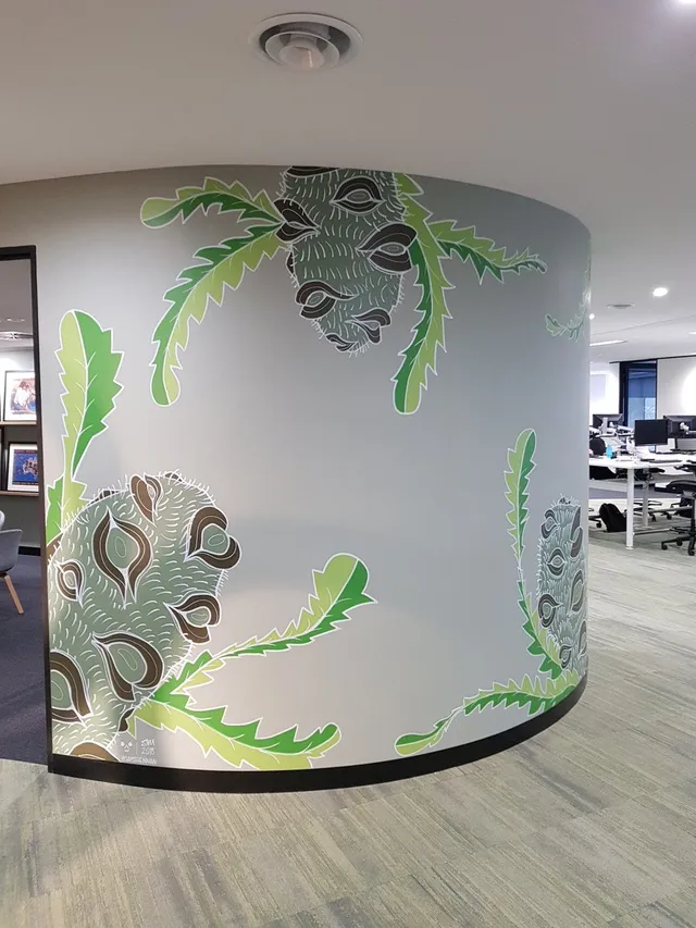 Curved office wall mural of stylized banksia pods and jagged green leaves with bold white outlines