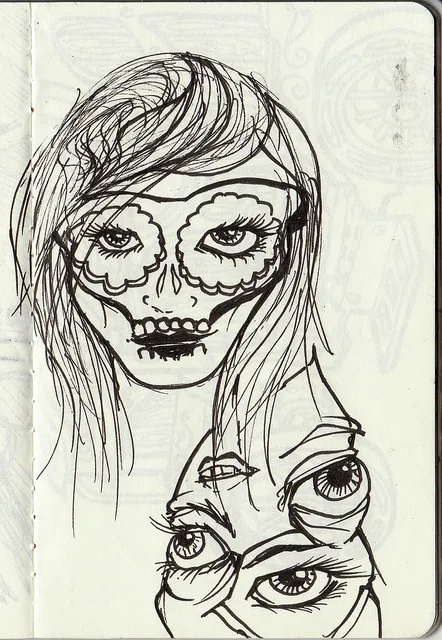 Black ink sketchbook drawing of a woman with sugar skull makeup above a surreal cluster of eyes