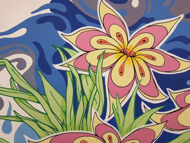 Mural detail of a stylized pink and yellow flower and green grass against a swirling blue background