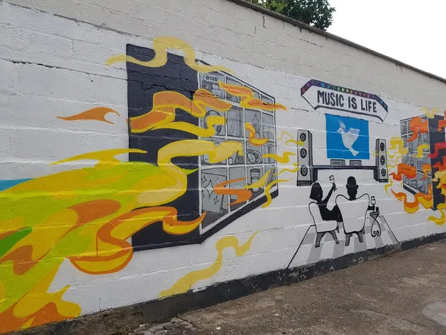 Mural on a white wall with yellow flames, a Music is Life banner, and a couple enjoying a stereo system in black and white