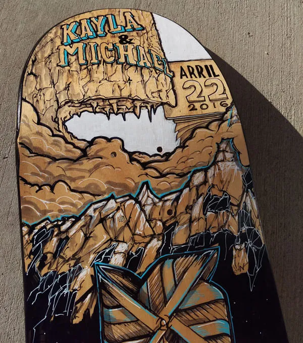 Hand painted typography skateboard graphic.