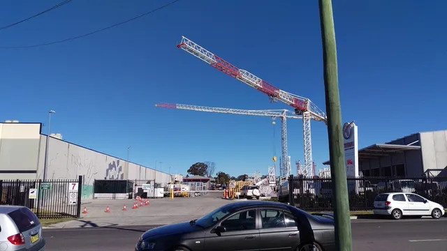 Beginning of mural with lot and cranes