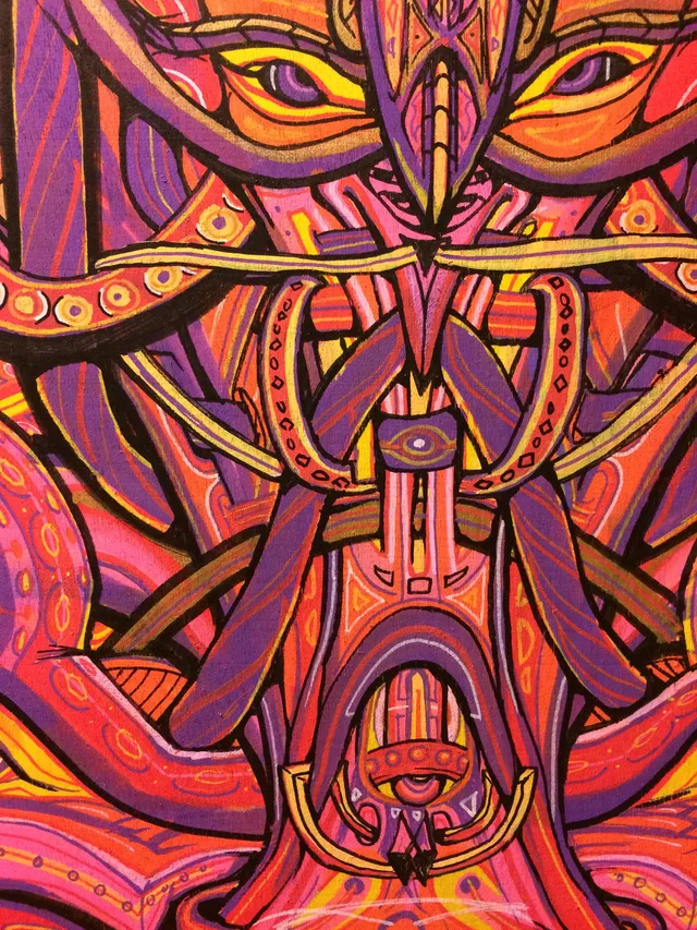 Psychedelic illustration of a symmetrical totemic face with yellow eyes and vibrant pink, purple, and orange patterns