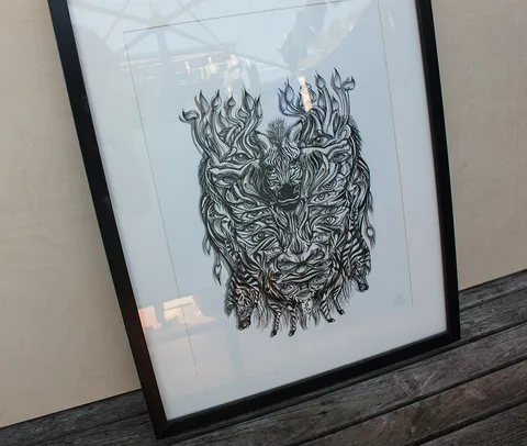 Framed ink drawing of a psychedelic, symmetrical zebra mask featuring multiple eyes and bold line work