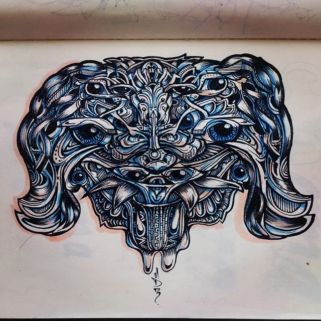 Symmetrical ink drawing of a multi-eyed psychedelic beast mask with fangs and blue shading