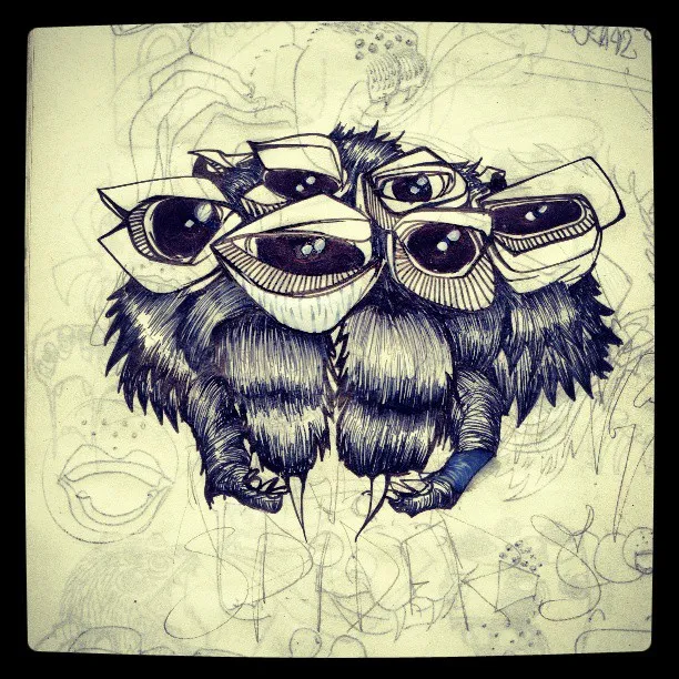 Ink drawing of a furry, multi-eyed creature with sharp claws on a sketchbook page