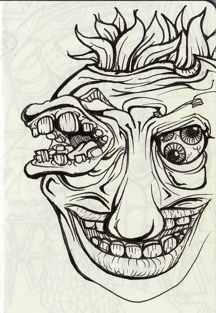 Ink drawing of a surreal grinning face with a toothy mouth in one eye socket and two eyeballs in the other