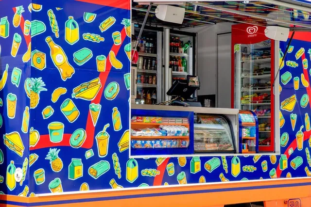 Creative vehicle wrap designed by Sam Shennan for mobile store