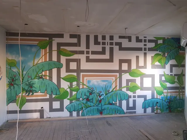 Interior wall mural combining a grey geometric maze pattern with large green leafy plants and painted blue sky windows