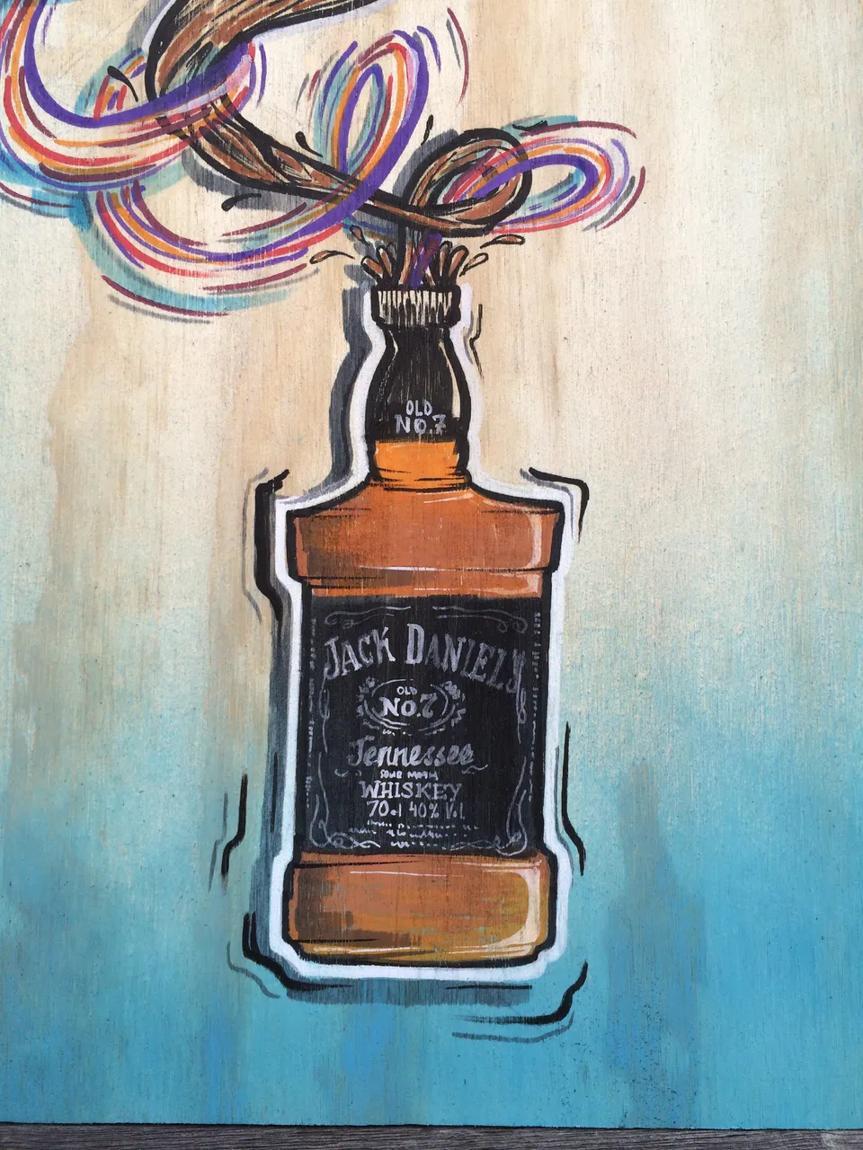 Jack Daniel's bottle mural on wood, with colorful psychedelic swirls bursting from its neck