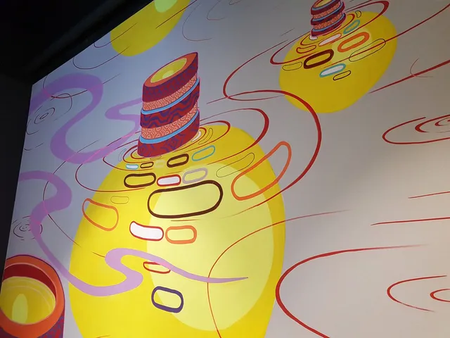 Mural of abstract patterned cylinders emerging from glowing yellow circles surrounded by swirling red and purple lines