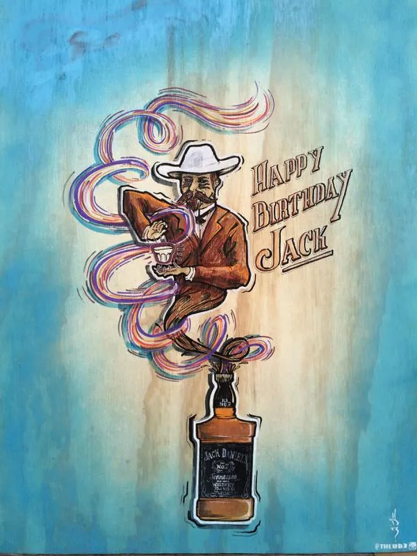 Painted illustration of Jack Daniel's bottle with a man in a hat and "Happy Birthday Jack" on wood