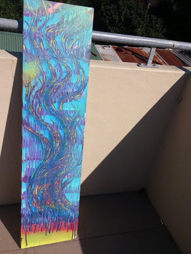 Tall canvas painting of a twisting, abstract purple tower with swirling yellow lines on a bright blue background