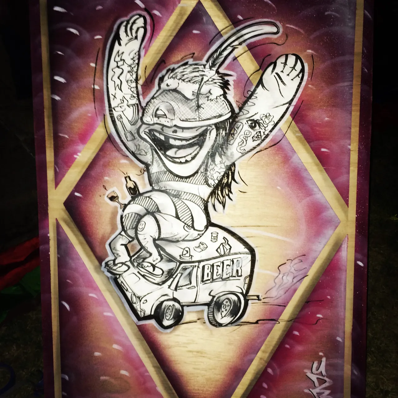 Mixed media illustration on wood of a wild tattooed cartoon character riding atop a beer van