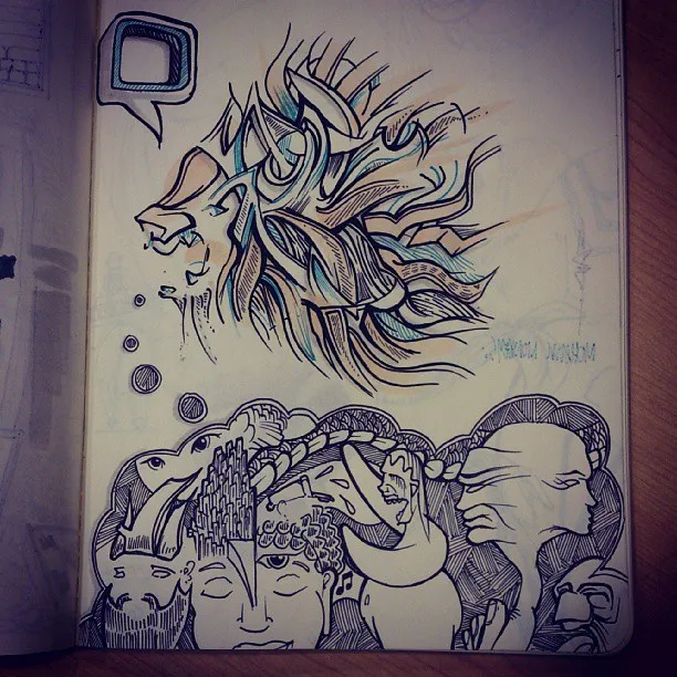 Sketchbook ink drawing of a stylized lion profile with a flowing mane above a cluster of surreal, overlapping faces