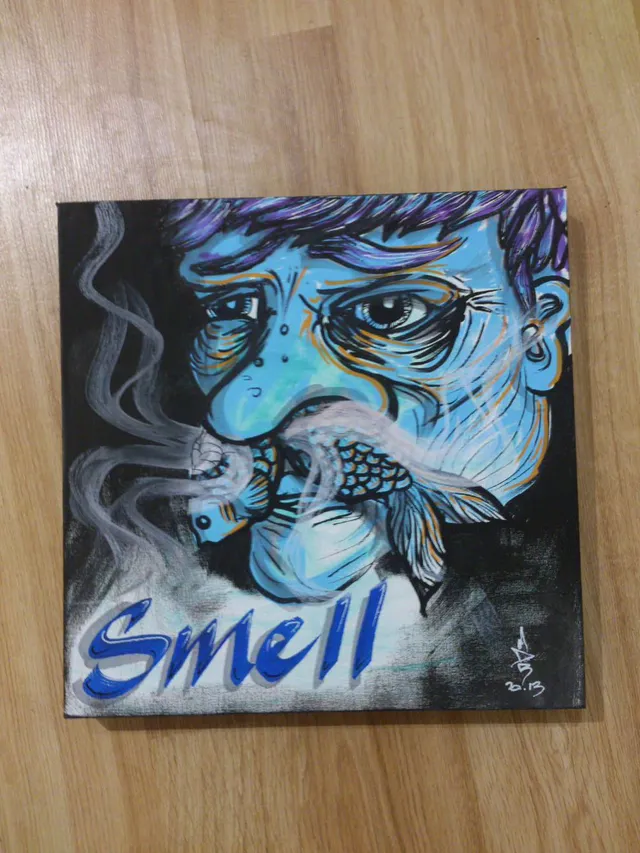 Canvas painting of a blue face inhaling smoke from a fish in its mouth, with the word SMELL below
