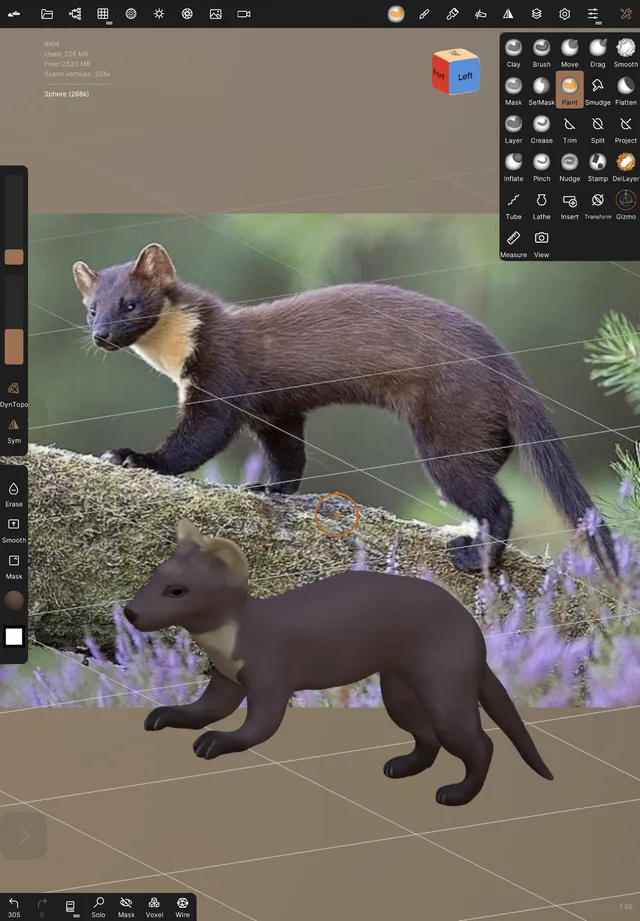 3D sculpting software interface displaying a reference photo of a marten above a matching work-in-progress 3D model