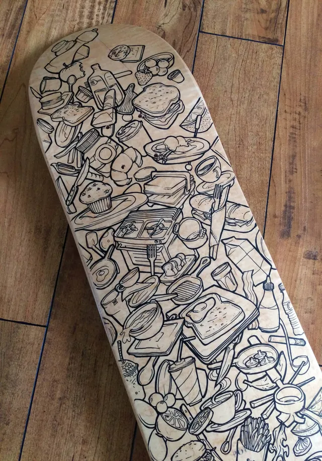Process shot for handpainted DIY skateboard graphic