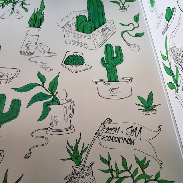 Black line art mural with green plants growing out of household objects like a kettle, hairdryer, and a sneaker