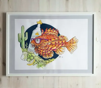 Framed illustration of a lionfish wearing purple glasses alongside a tequila bottle, cactus, and lime wedges