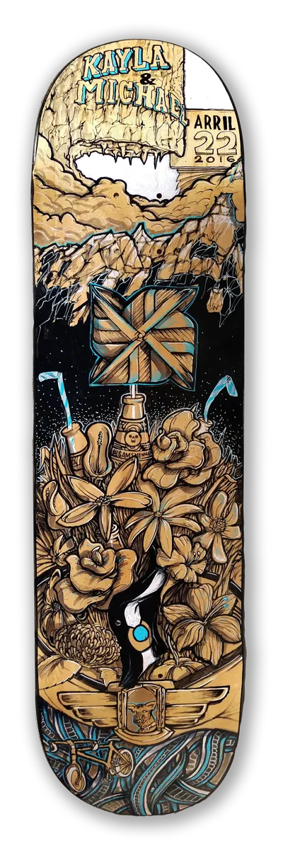 Painted skateboard featuring detailed gold and black illustration of a pinwheel, dense flowers, and mountains