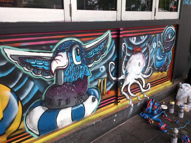 Mural in progress depicting a stylized blue bird on a life ring and a white octopus, with spray cans on the ground