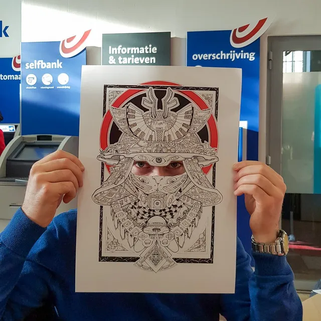 Person holding an intricate black and white samurai mask illustration poster over their face, real eyes peering through