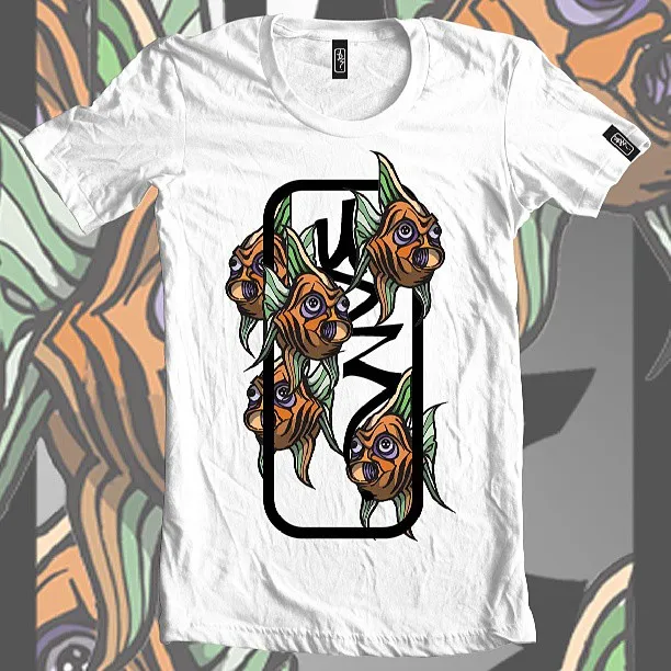 White t-shirt displaying a graphic illustration of four stylized orange and green fish around a black frame