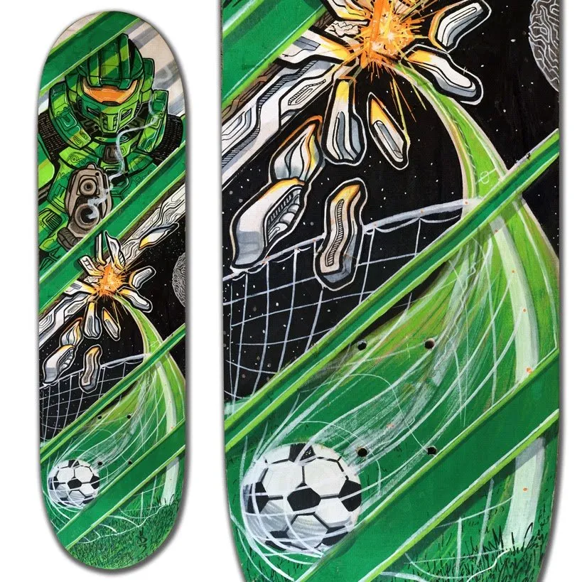 Painted skateboard depicting a green armored soldier, an explosion in space, and a soccer ball hitting a net