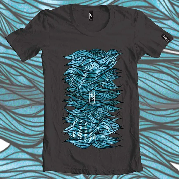 Dark grey t-shirt featuring a graphic illustration of stylized flowing blue waves with bold black linework