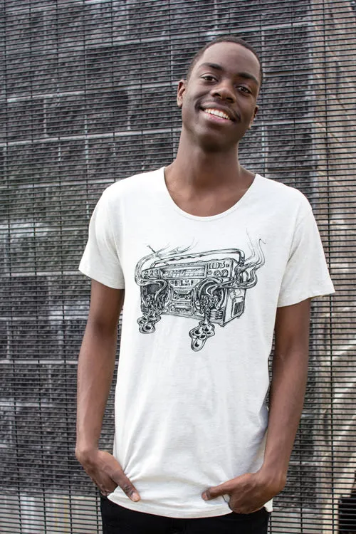 Man wearing a white t-shirt printed with a black ink illustration of a melting, smoking boombox