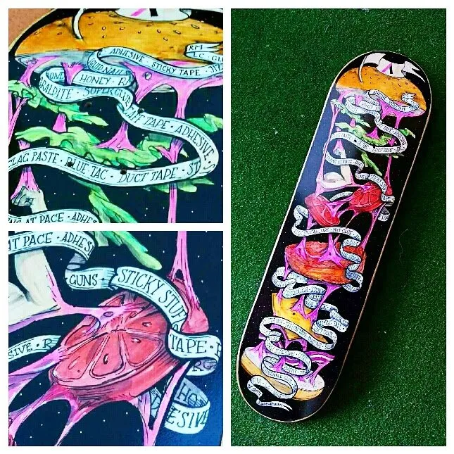 Painted skateboard featuring a deconstructed burger bound by pink slime and banners listing types of adhesives