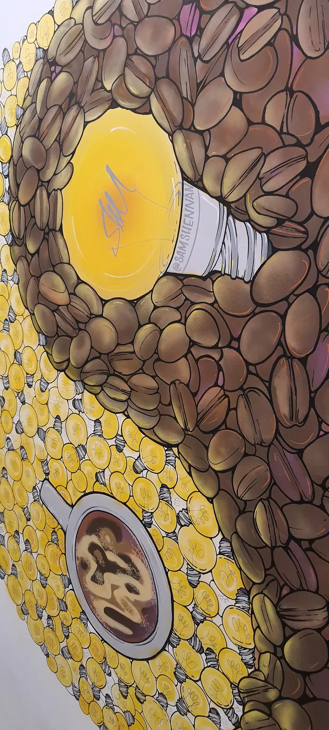 Mural of a glowing yellow lightbulb among coffee beans next to a coffee cup surrounded by smaller lightbulbs