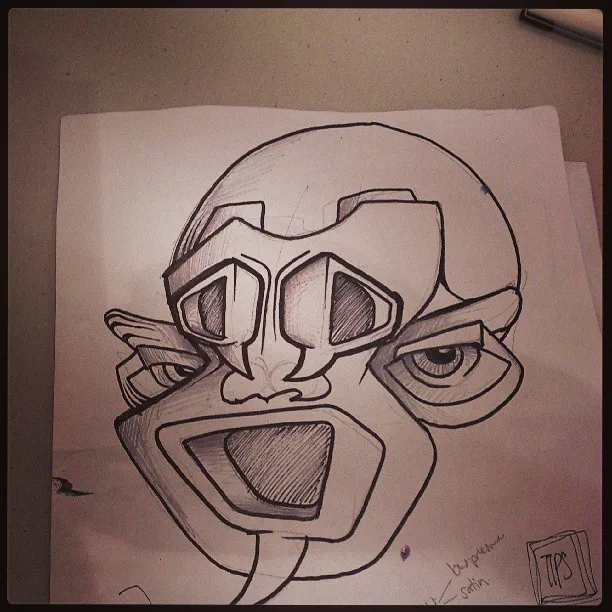 Ink sketch on paper of a totemic, geometric face with bold lines and a wide open mouth