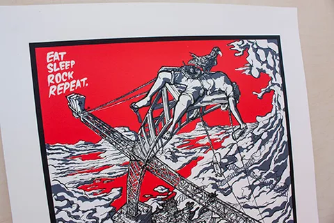 Screenprint reading Eat Sleep Rock Repeat, depicting a figure slumped on a metal crane with a bird on their chest