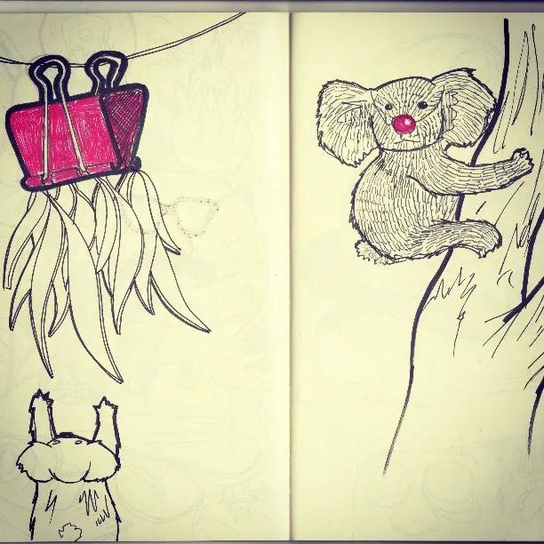 Ink sketchbook drawing of a red-nosed koala climbing a tree opposite a pink binder clip holding leaves