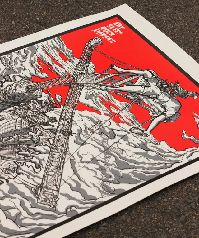 Screenprinted rock poster on road closeup