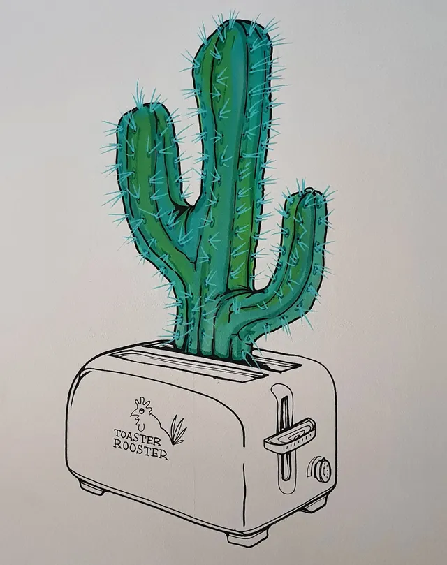 Mural of a green cactus sprouting from a line-drawn toaster featuring a Toaster Rooster logo