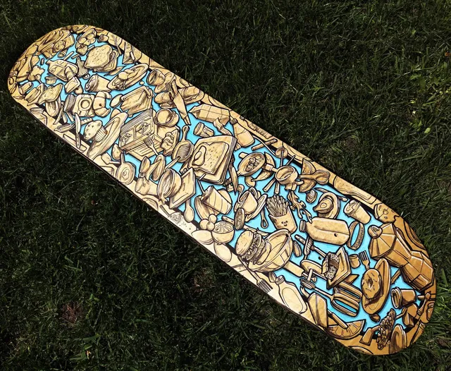 Closeup of handpainted custom skateboard graphic with brunch themed cafe illustration