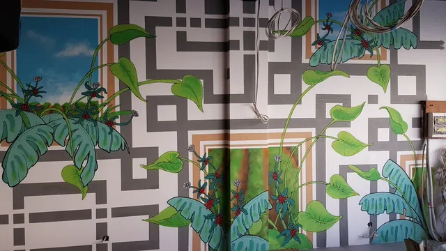 Mural featuring green tropical plants and berries weaving through a grey geometric maze and painted sky windows