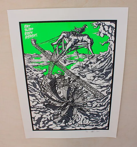 Screenprint of a figure and eagle on a crane above a swirling city against a green sky, reading Eat Sleep Rock Repeat