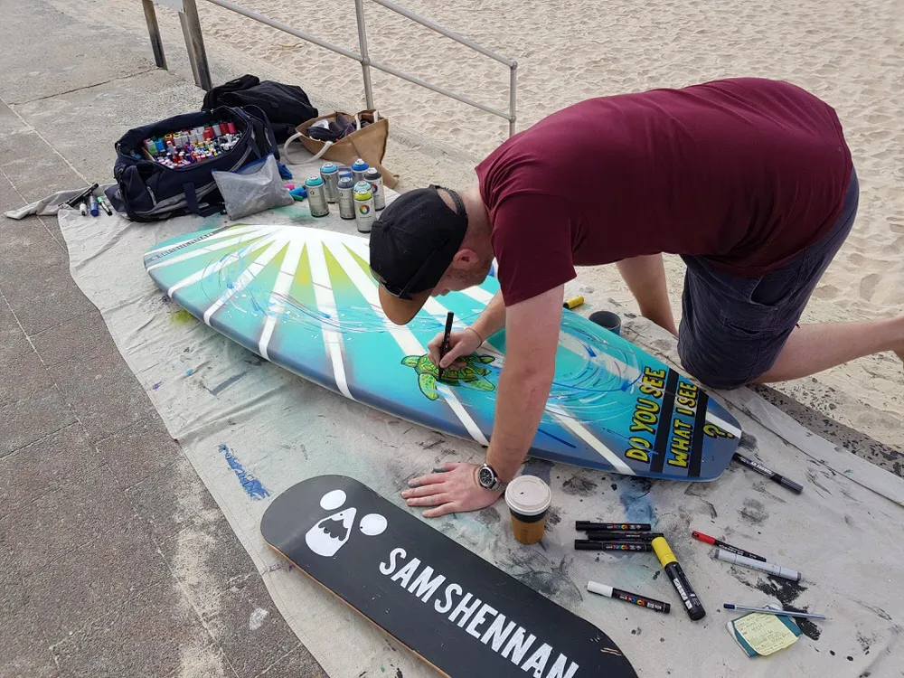 Painting boards on the beach
