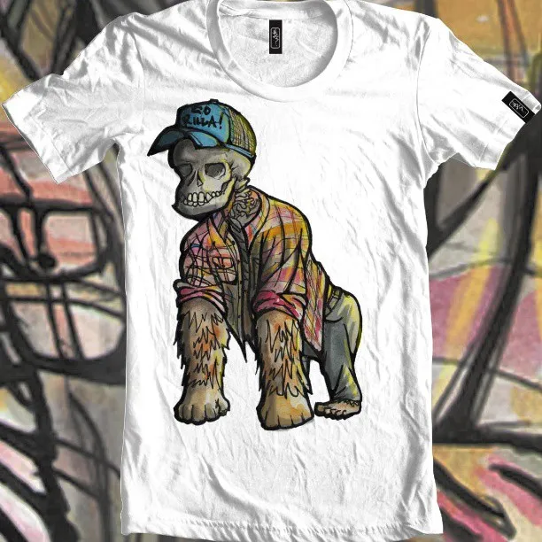 White t-shirt featuring an illustration of a skull-faced gorilla wearing a plaid shirt and a blue cap reading GO RILLA