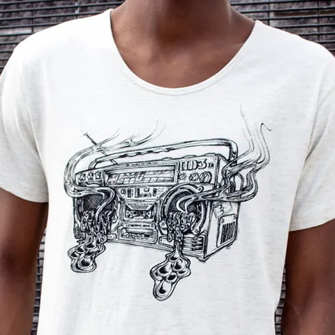 White t-shirt featuring a black line drawing of a boombox emitting smoke and oozing liquid from its speakers