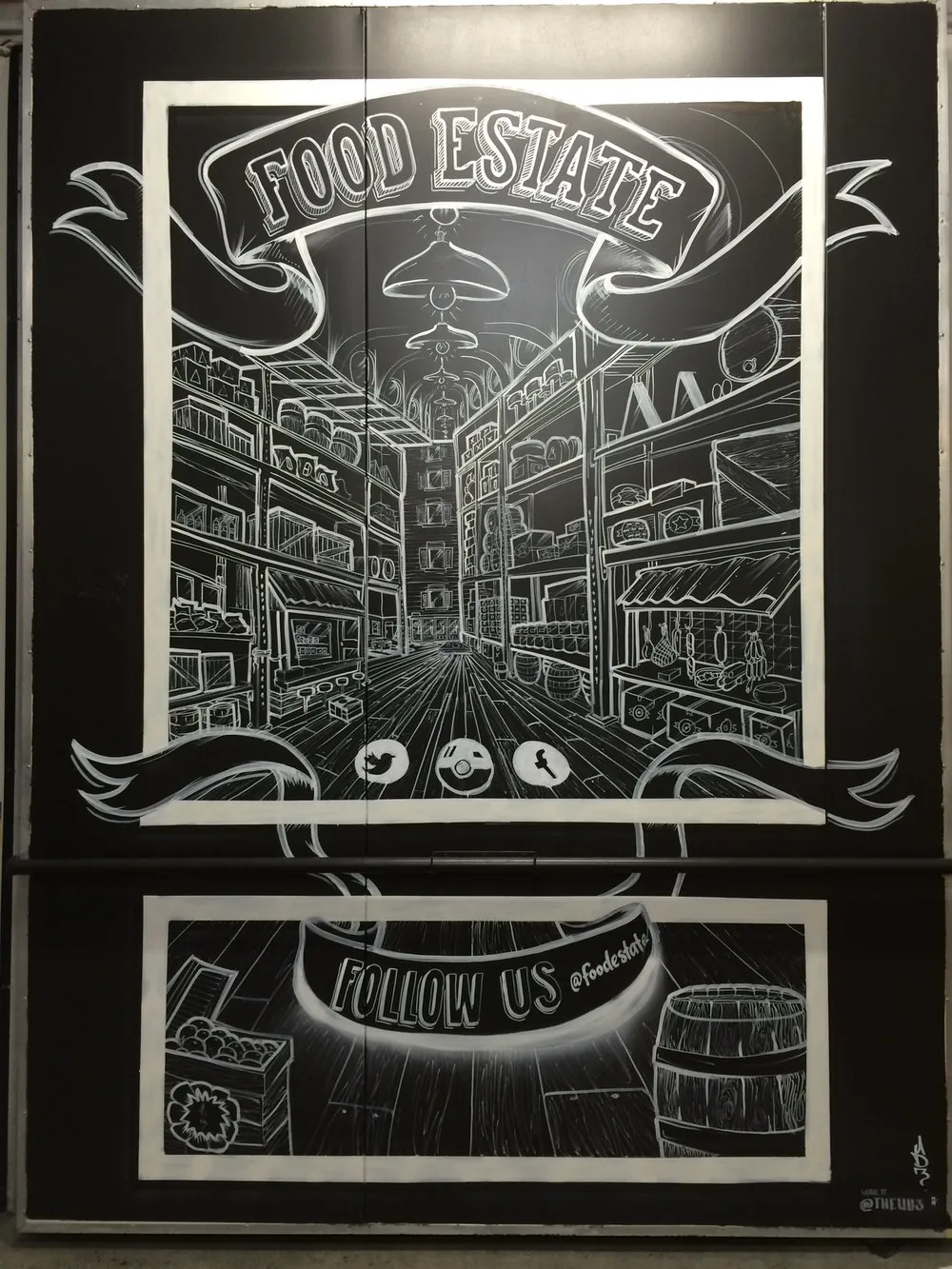 Black and white mural of a food market aisle in deep perspective, featuring shelves of goods and a Food Estate banner