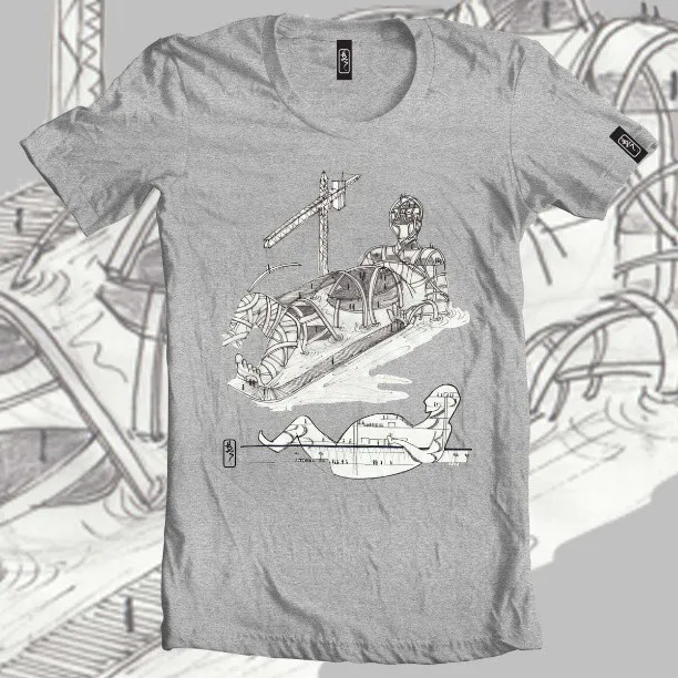 Grey t-shirt with a black line drawing of a reclining mechanical figure under a crane and a smaller blueprint figure