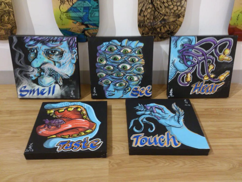 Five canvas paintings depicting the five senses with surreal illustrations and text for Smell, See, Hear, Taste, and Touch