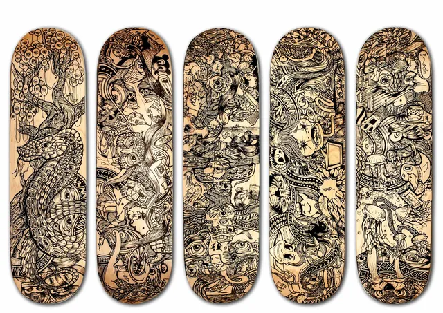 Five wooden skateboard decks hand-painted with dense black line art of psychedelic, totemic animals and faces