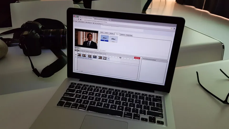 Laptop with video editor showing Obama, camera, glasses